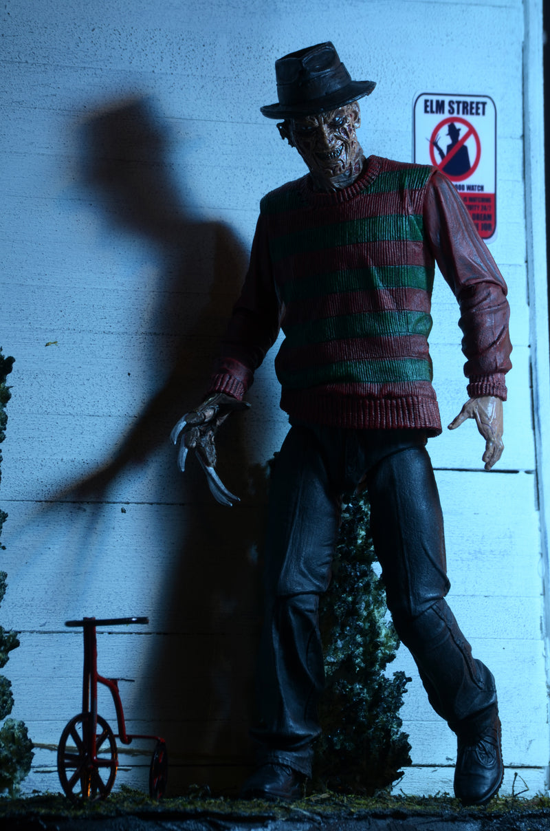 NECA Figura de Accion Ultimate: Pesadilla En La Calle Del Infierno 30 Aniversario - Freddy 7 Pulgadas
